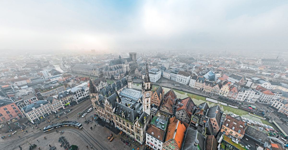 Ghent Travel Guide: Planning Tips, Costs and Things to Do Stunning aerial cityscape of Ghent, Belgium with historic architecture and tram lines.