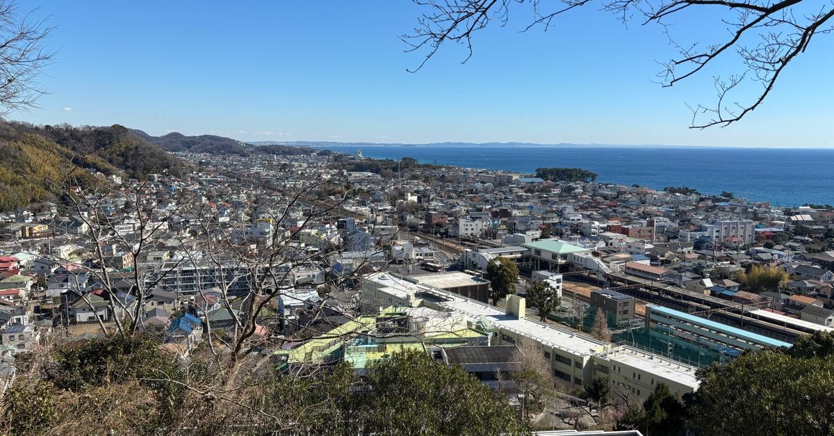 Business Hotel Takizawa in Takasaki: Steps from the Gunma Music Center A stunning aerial view of Kamakura cityscape by the sea with clear skies.