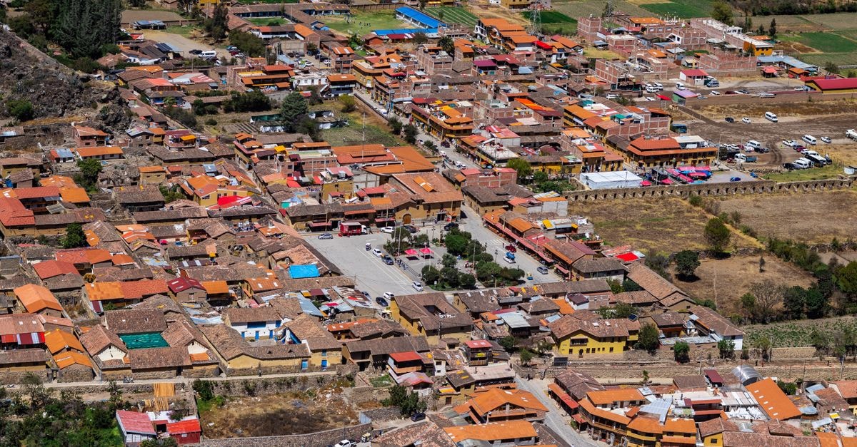 Colorful aerial view of a rural town with distinctive architecture.