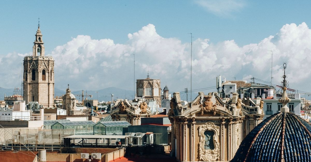 Hotel El Ciclón in Valencia: A Quiet Stay on Calle 94 Cantaura Skyline of Valencia with historic architecture and towers under a bright sky.