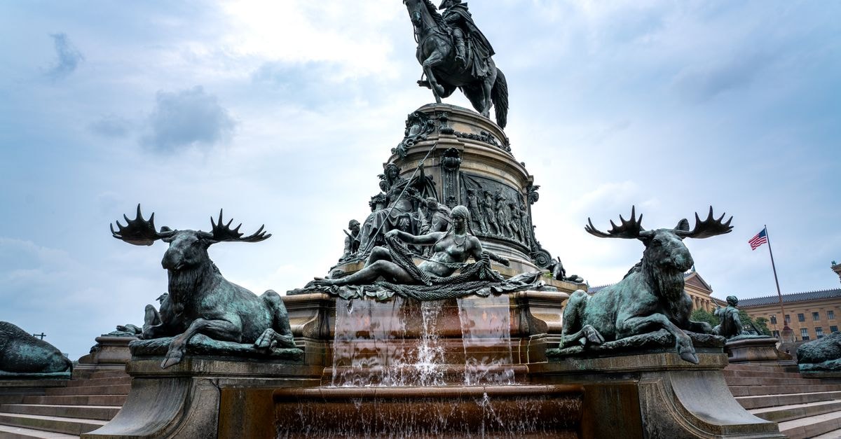 Hotel Florida in Filadelfia: A Chaco Oasis With Galleries and Gardens Majestic statue fountain with animal sculptures at Philadelphia's city center on a cloudy day.