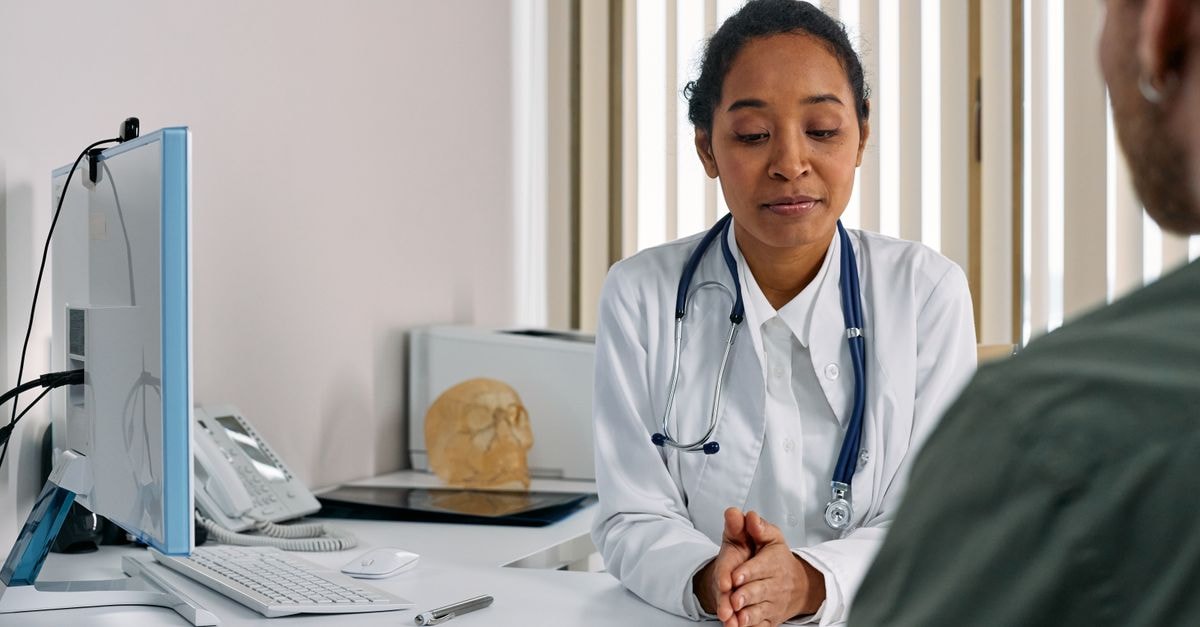 McKesson Tops Q2 Healthcare Providers & Services Group as Shares Trade Flat Post-Earnings A female doctor consulting a patient in a modern medical office setting.