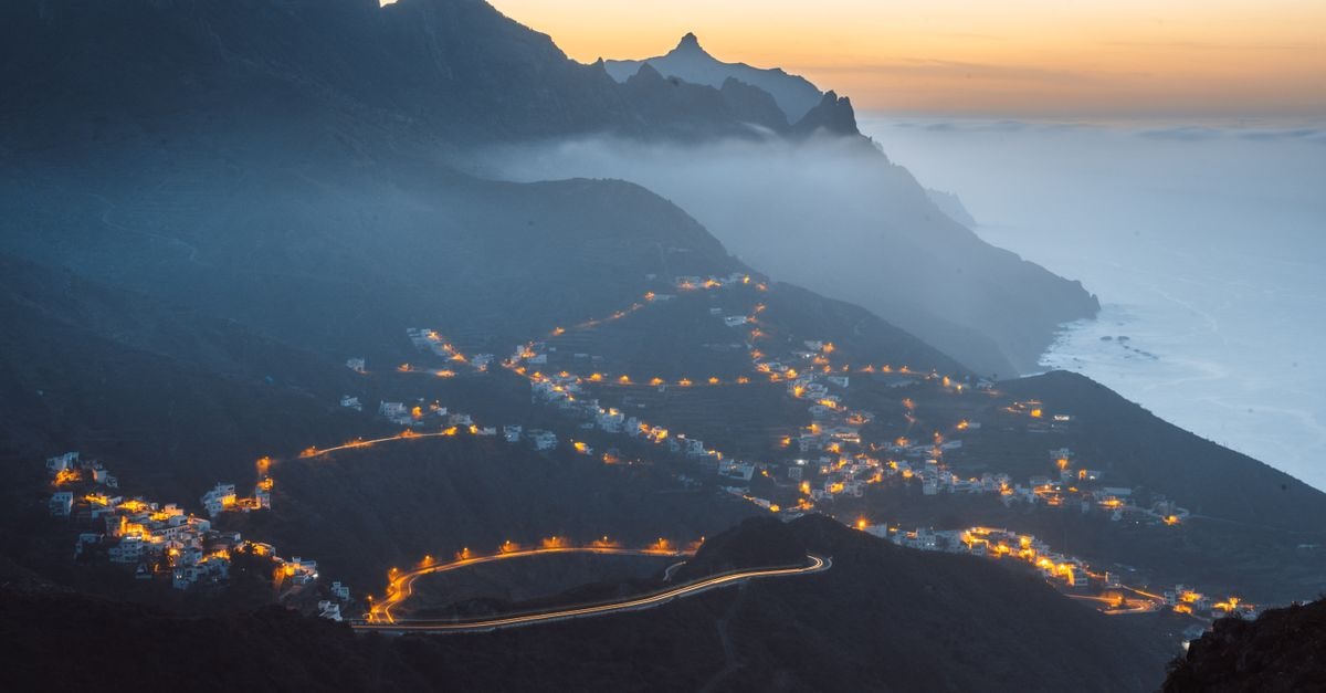 Hotel Príncipe Paz, Santa Cruz de Tenerife: Plaza-View Stay in the City Center Aerial view of illuminated town and mountains at twilight in Santa Cruz de Tenerife, Spain.