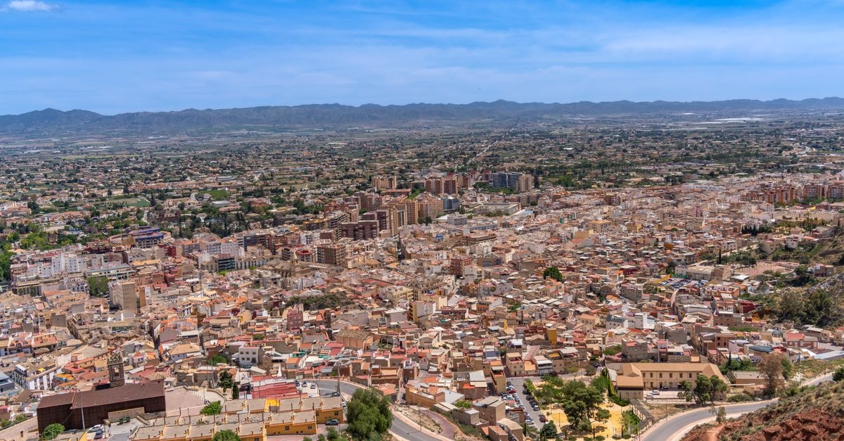 Alexandre Fira Congress, L'Hospitalet de Llobregat — A Design Hotel Across From Fira Gran Vía Aerial view of Lorca, Murcia, Spain showcasing the city's architecture and landscape under a clear blue sky.