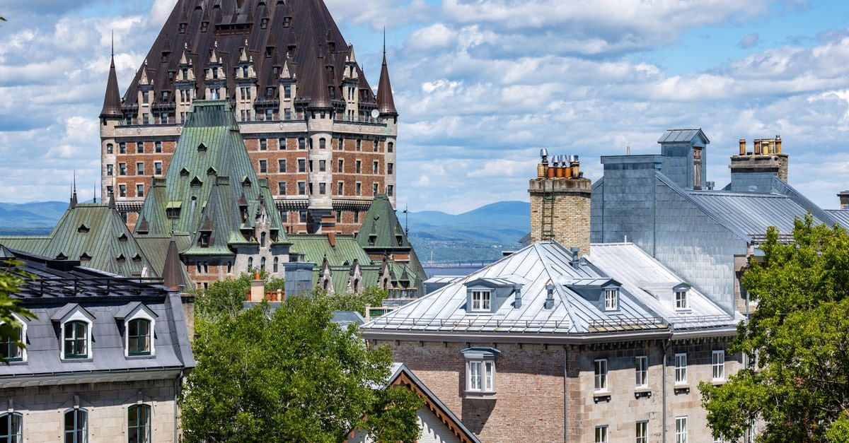 Hilton Quebec, Québec City — A Skyline Landmark Reimagined Capture of the iconic Château Frontenac amidst Quebec City's classic architecture under a vibrant summer sky.