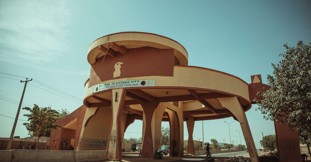 Entrance archway to Katsina City, distinct architectural design on a sunny day.