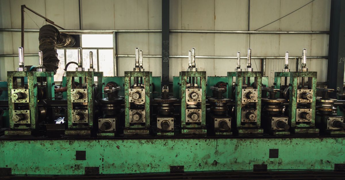 USITC Launches Anti-Dumping Probes on Welded Stainless Steel Pipes from Turkey, India and UAE Heavy machinery in a factory setting for manufacturing process