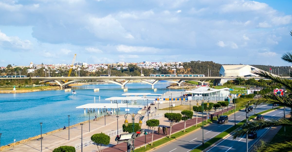 Iberostar Selection Kuriat Palace, Monastir: Beachfront Stay Near Sousse Scenic view of Rabat's waterfront showcasing modern bridge architecture and blue skies.