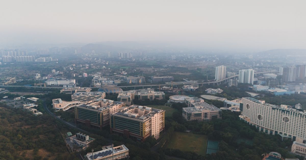 Da Casa Business Hotel in Pune: A Central Somwar Peth Stay Near Shaniwar Wada Aerial view of urban buildings in Pimpri-Chinchwad, Maharashtra, India at daytime.