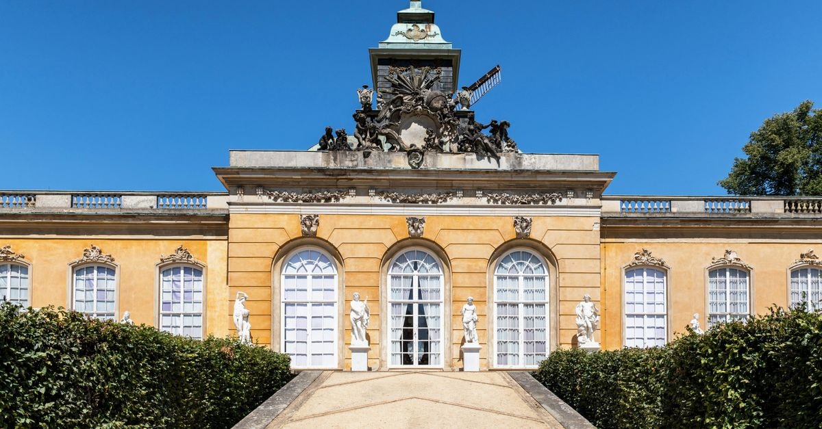 A Quiet Royal City: A Thoughtful Potsdam Travel Guide Baroque facade of Sanssouci Palace in Potsdam, Germany with historic architecture.