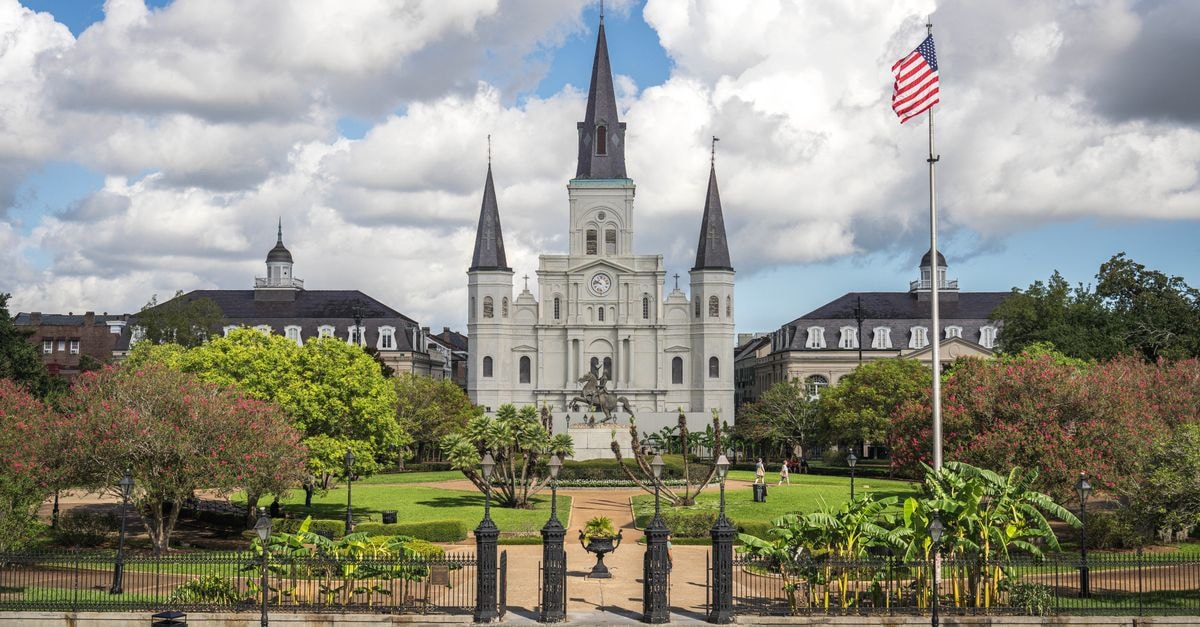 Aloft New Orleans Downtown: Central Stay Near Musical Legends Park Capture of Jackson Square with St. Louis Cathedral in New Orleans under a vibrant sky.