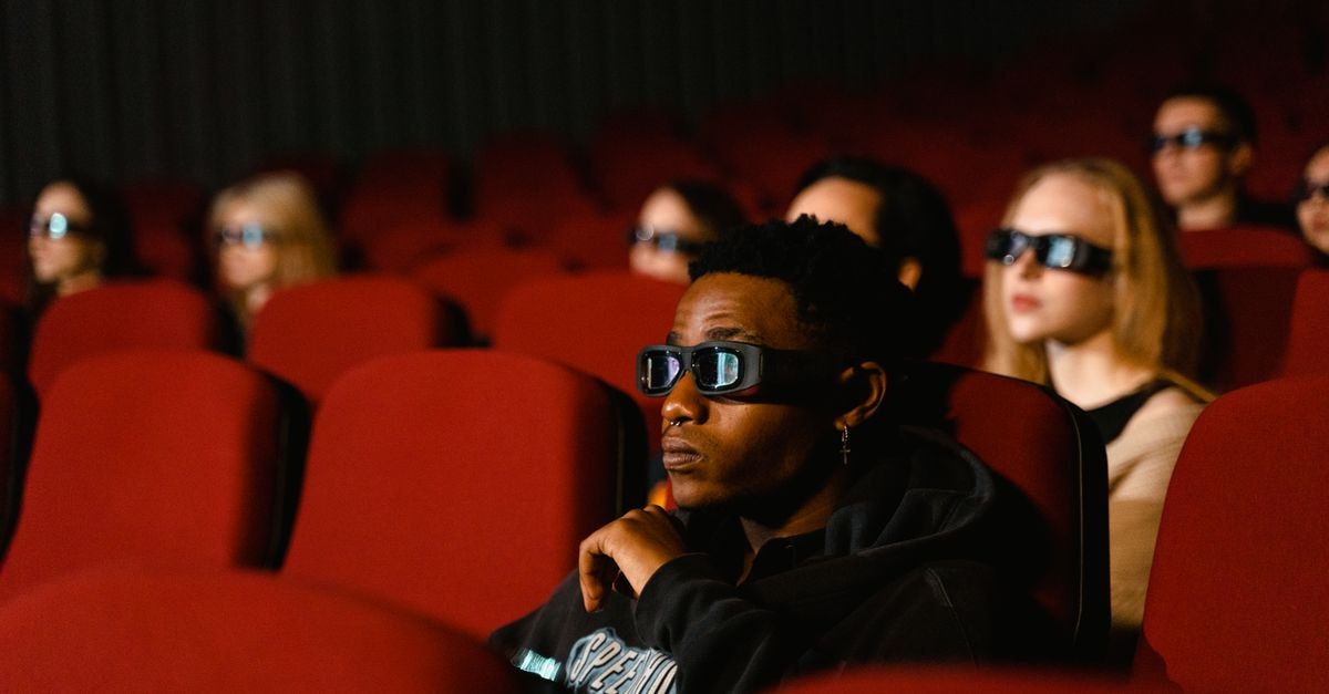 Rani Mukerji's Mother Krishna Mukerji Dies at 75 A diverse group of people wearing 3D glasses enjoying a movie in a cinema with red seats.