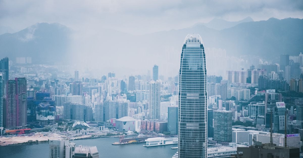 Panoramic view of Hong Kong's modern skyline featuring iconic skyscrapers and urban architecture.