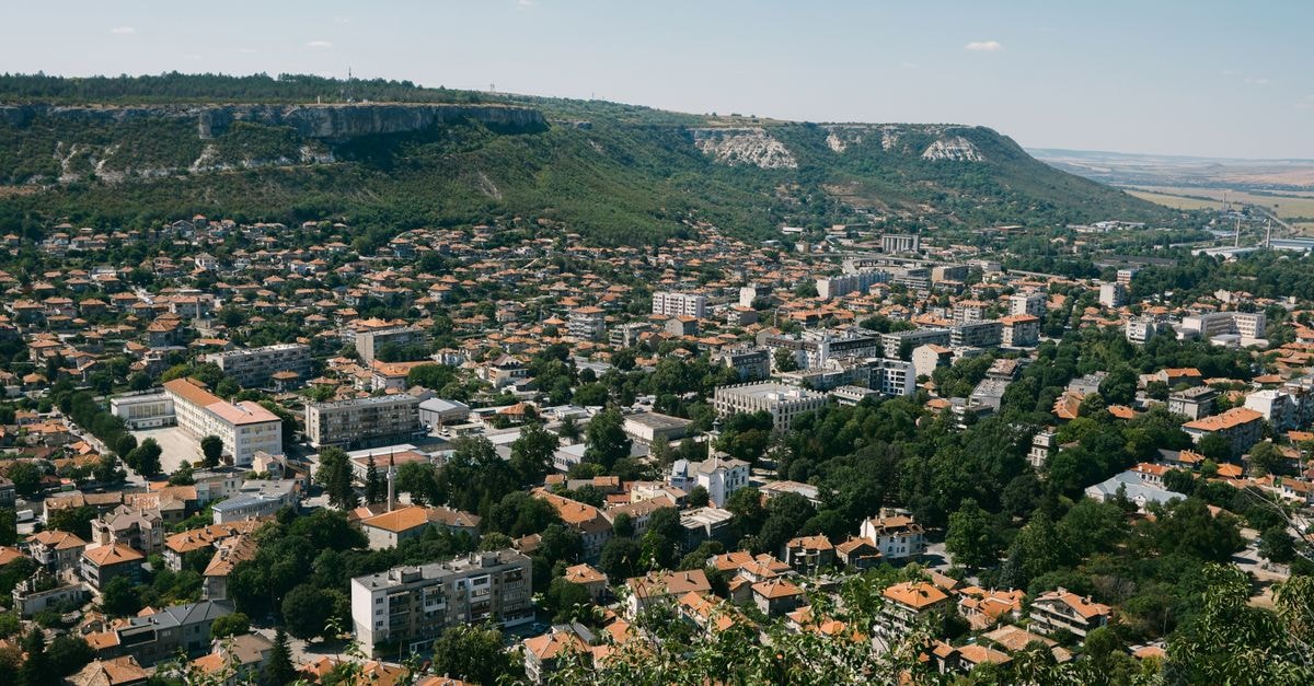 Hotel Racova in Vaslui: A Civic-Square Landmark Since 1972 Panoramic aerial view of Varna, Bulgaria, showcasing urban architecture and surrounding greenery.