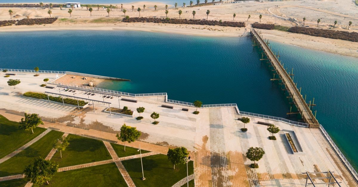 Al Diwaniyah Travel Guide: Planning Tips, Costs and Things to Do Aerial shot of the picturesque Al Jubail waterfront promenade in Saudi Arabia.
