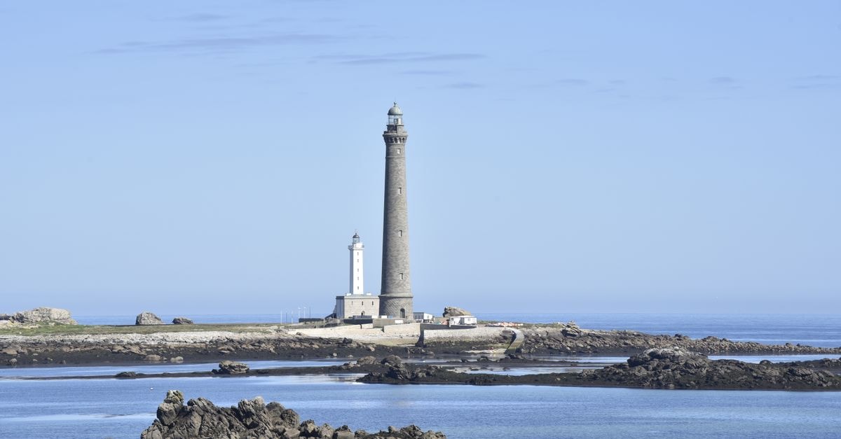 Kratovo Travel Guide: Towers, Stone Streets & Flavors A majestic lighthouse on rocky seashore with clear blue sky, capturing the serene coastal landscape.