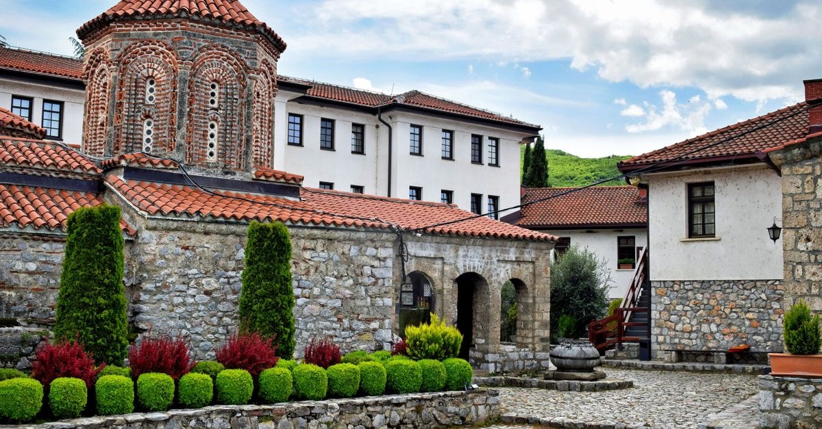Focşani Travel Guide: Planning Tips, Costs and Things to Do Charming historic monastery courtyard in Ohrid, featuring traditional stone architecture and serene greenery.