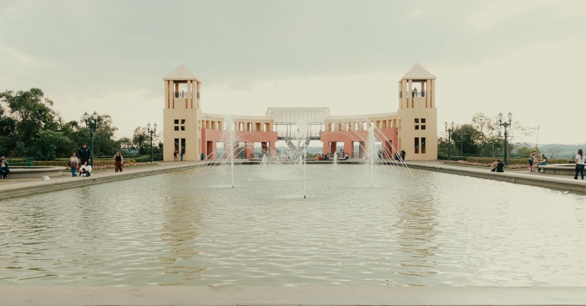 Gaborone Travel Guide: Planning Tips, Costs and Things to Do Architectural landmark with fountains at Curitiba's famous park on a cloudy day.