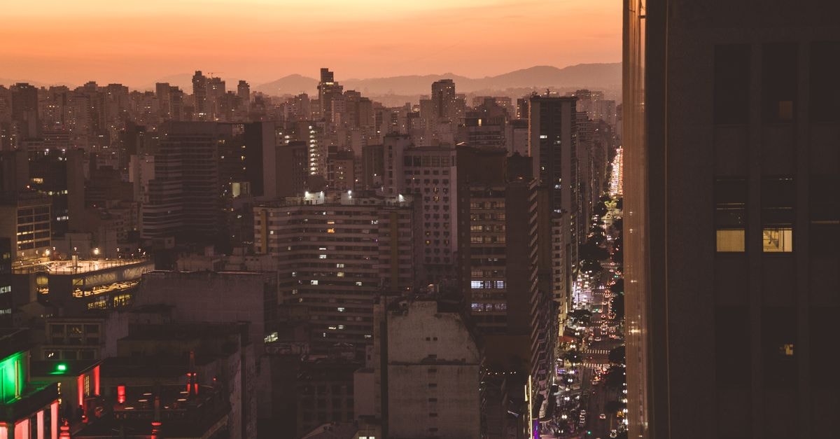 A breathtaking view of Sao Paulo's skyline illuminated during sunset, showcasing urban architecture.