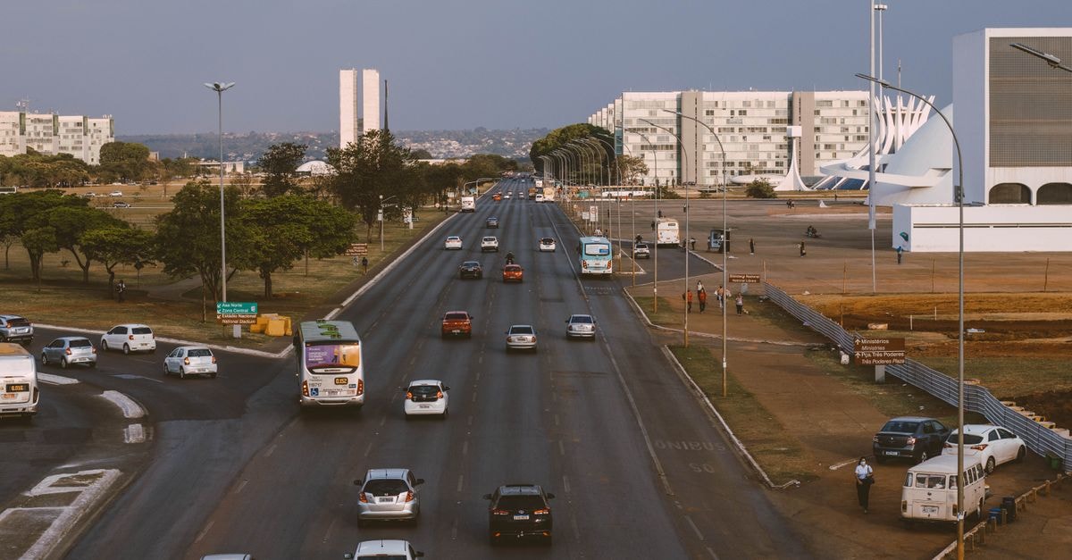 Visiting Harare: an evergreen travel guide for first-time visitors Aerial view of Brasília's urban traffic with prominent government buildings and a bustling road.