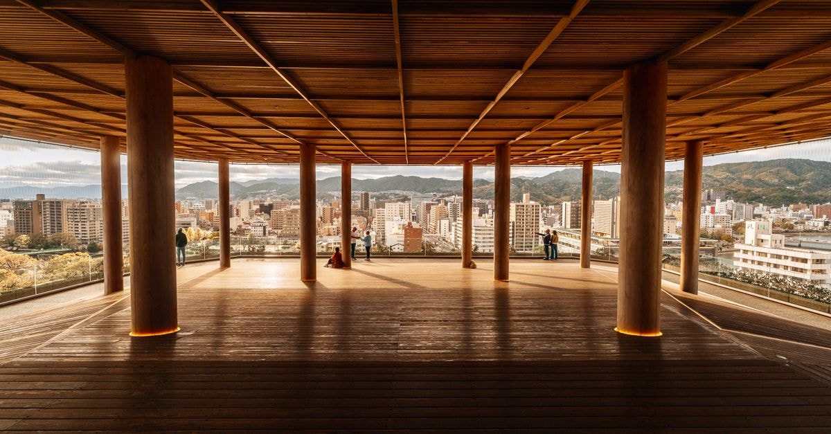 Hotel Hokke Club Hiroshima: A Peace Boulevard Stay Near the Museum A wooden architectural space with city view in Hiroshima, Japan, featuring a modern and minimalist design.