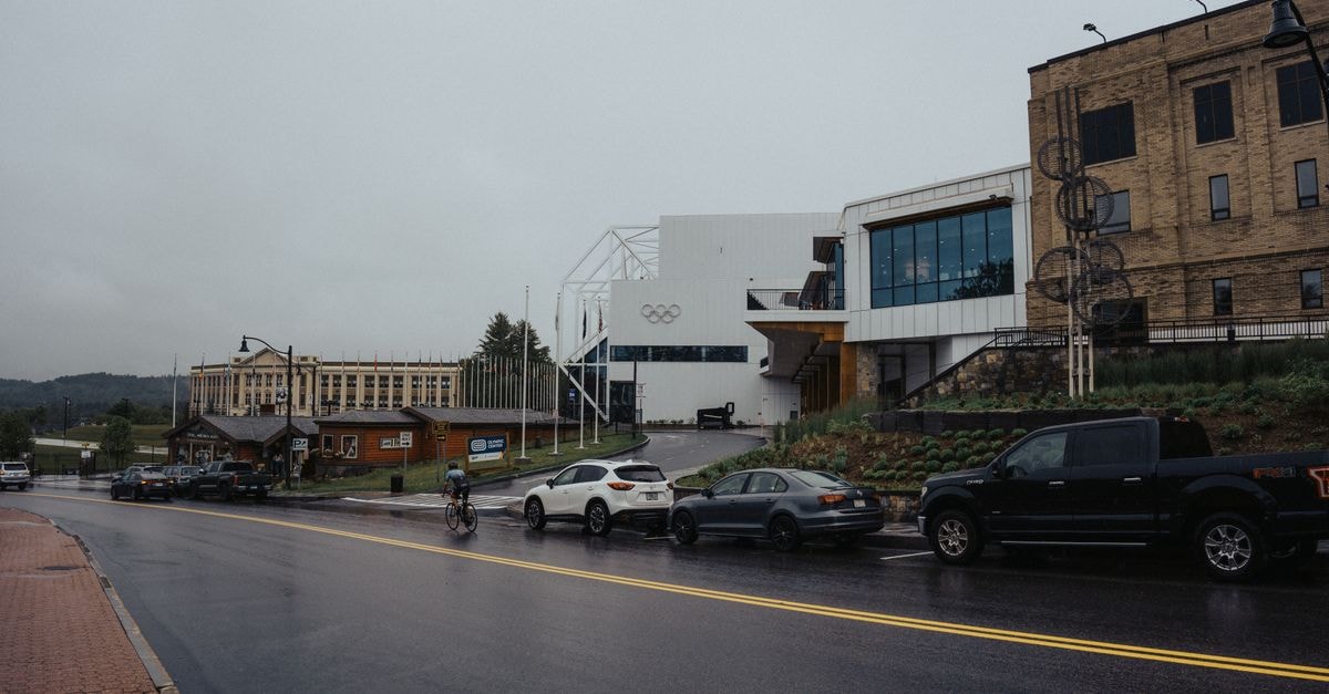 Olympic Hotel Ioannina: Stay on the New Pedestrian Street A cyclist rides past the Olympic Training Center on a rainy day.