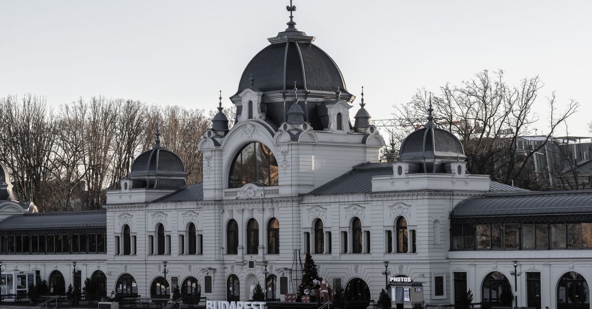 Békéscsaba Travel Guide: Hungary Beyond Budapest Elegant historic architecture of Budapest's City Park Ice Rink at dusk.