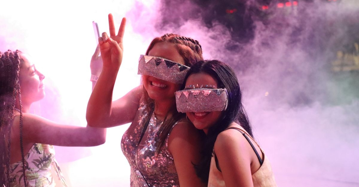 Hotel Florida Sincelejo: A Central Stay in the Heart of Sucre's Capital Two women enjoying nightlife with vibrant outfits in Sincelejo, Colombia. Perfect capture of youthful fun.