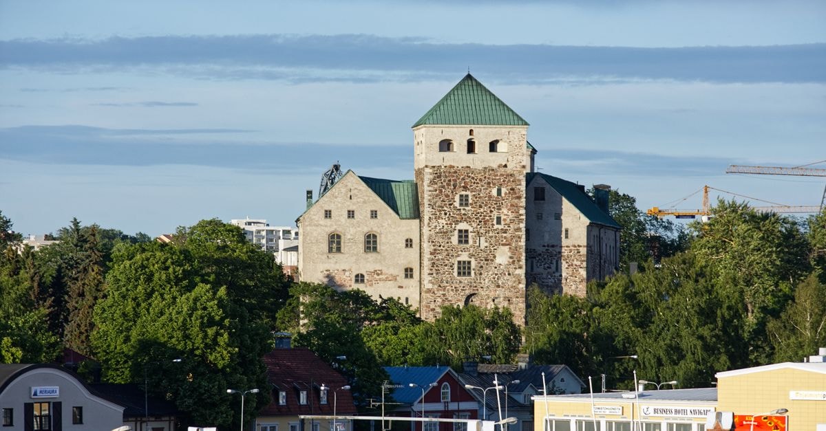 First Hotel Kokoloko in Visby: a Söderväg address on Gotland Turku Castle surrounded by lush greenery and modern architecture in summer.