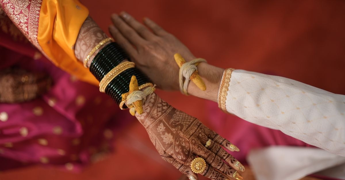Buffet de la Gare in Kankan: A Station-Era Hotel Reborn Intricate henna designs adorn bride's hands during kankan bandhan in traditional Indian wedding ceremony.