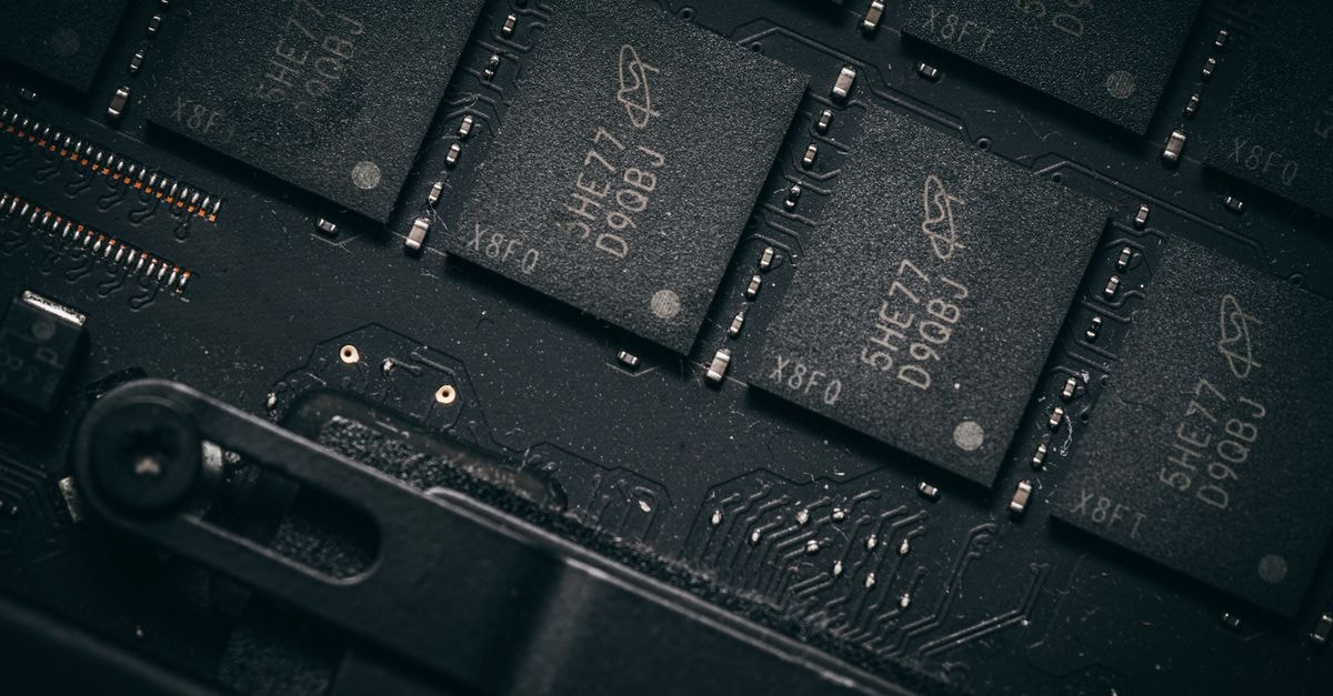 Palo Alto Networks beats quarterly estimates, acquires AI-native platform Console to expand Cortex Detailed shot of microchips on a circuit board, showcasing electronic technology and precision engineering.