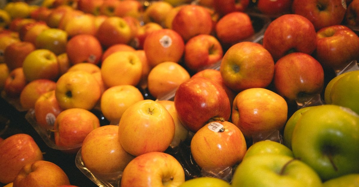Apple rolls out iOS 27 with upgraded Siri and Visual Intelligence Colorful assortment of fresh apples in a grocery store, perfect for healthy lifestyle visuals.
