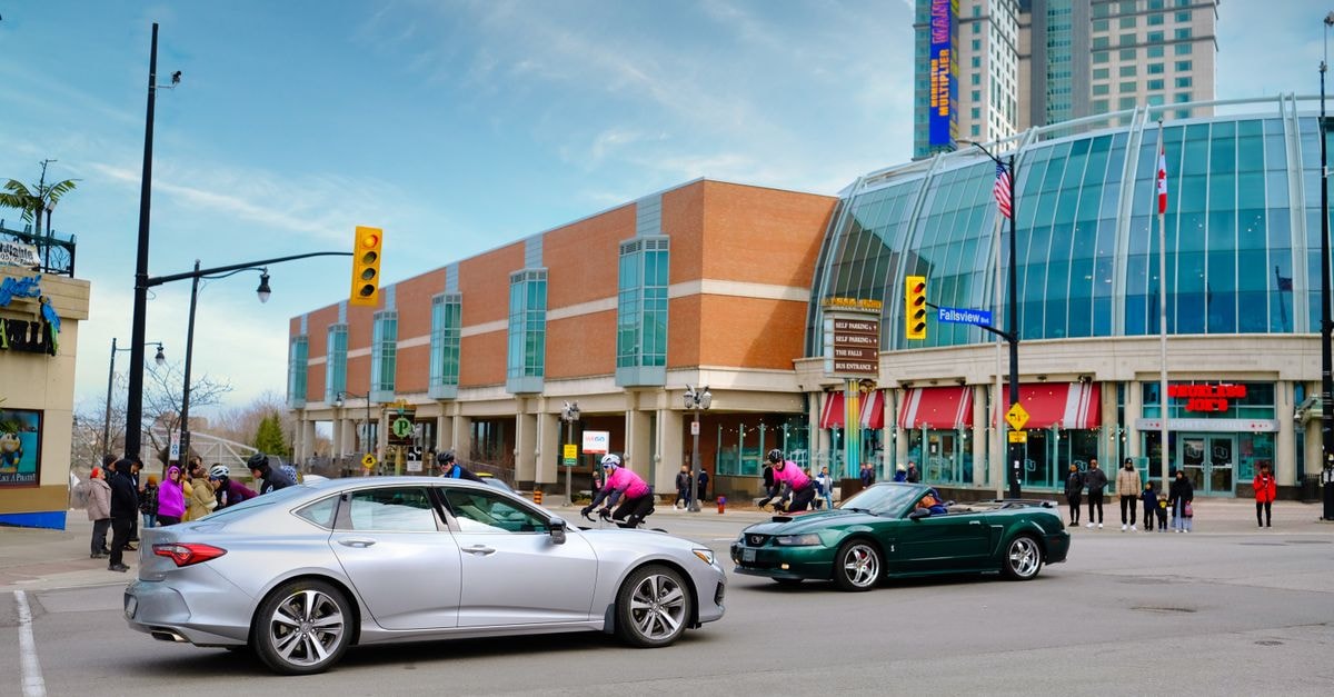 Mississauga Travel Guide: Getting Around, Eating Well, and Exploring Vibrant city street scene with modern buildings, cars, and people.