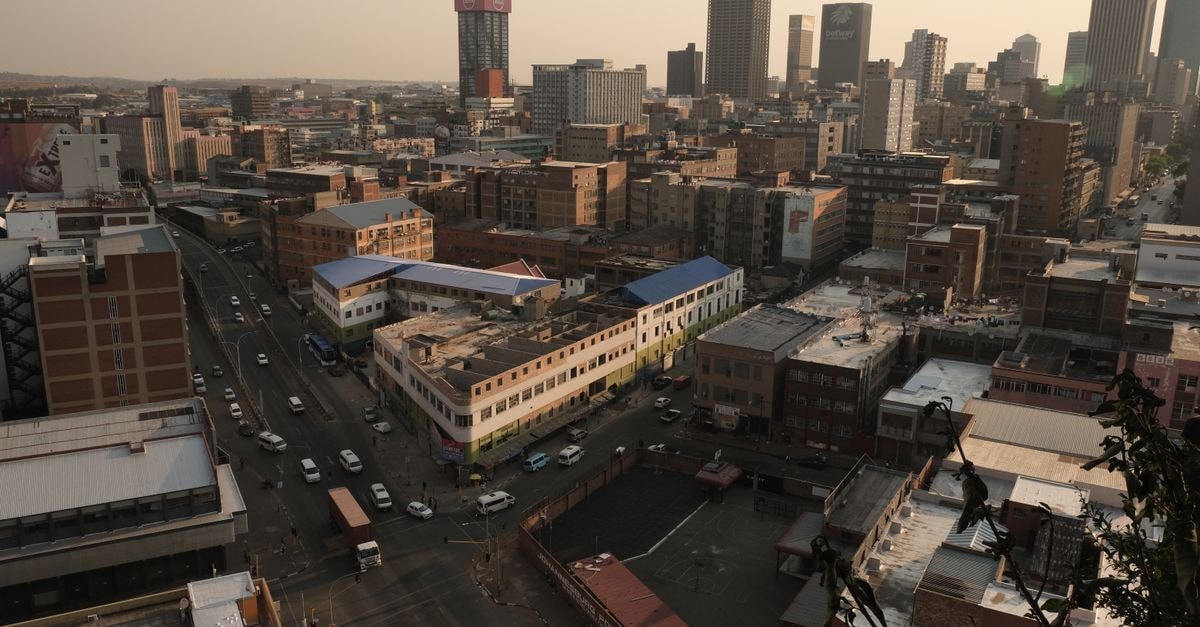 Kalahari Arms Hotel in Ghanzi: A Long-Running Gateway Stay Scenic aerial view of Johannesburg cityscape showcasing urban architecture in warm evening light.