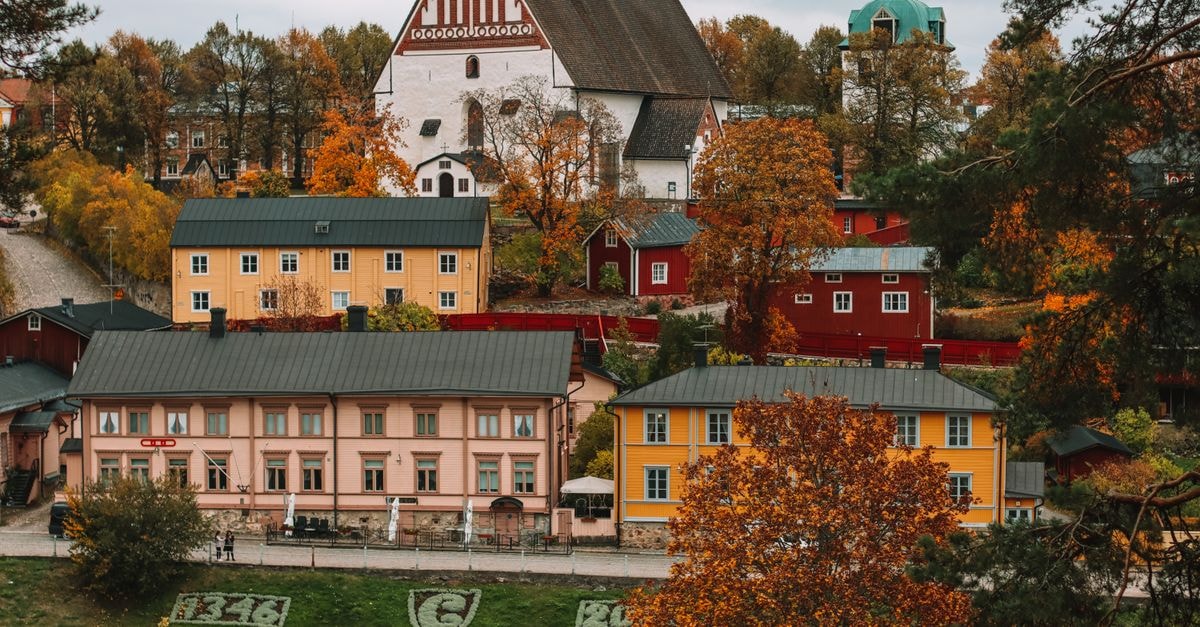 Explore the vibrant autumn scenery of Porvoo, Finland's traditional architecture.