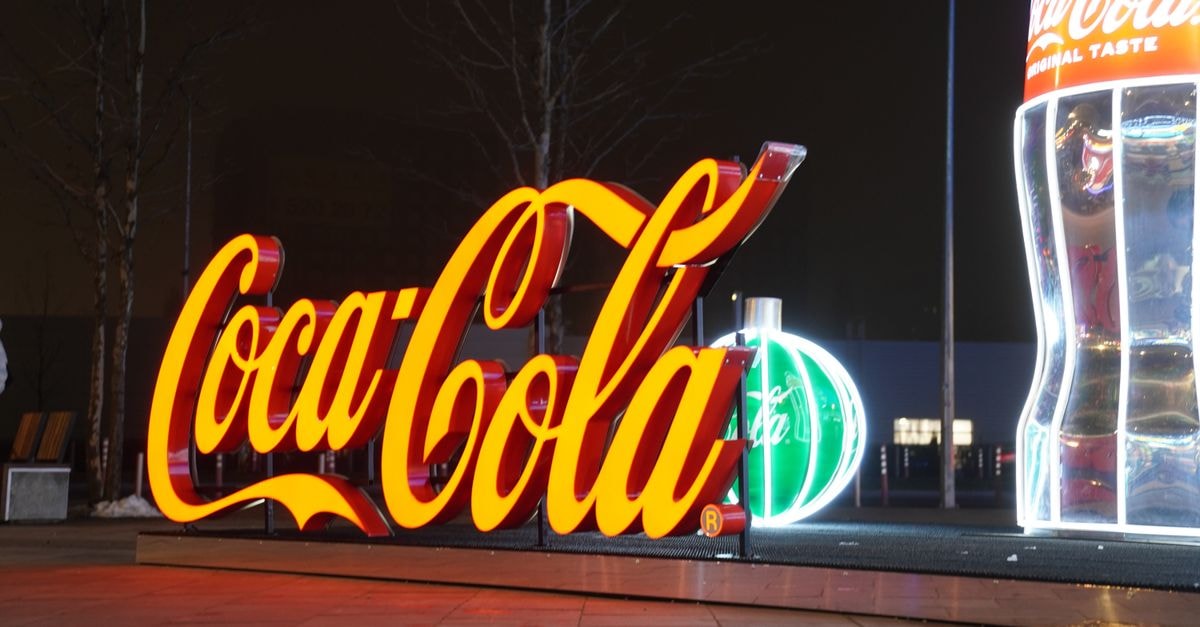 Coca-Cola Posts 7% Revenue Growth in Q2 2026, Powered by FIFA World Cup Campaign Vibrant Coca-Cola neon display in Kyiv, Ukraine, glowing brightly against the night sky.