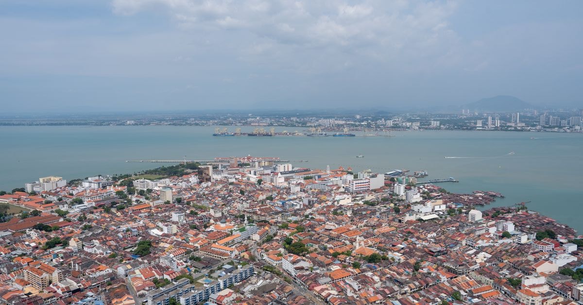 Merlin Hotel, Batam — A Quiet Stay on Jalan Sriwijaya A breathtaking aerial view of Georgetown, Penang highlighting the urban landscape and coastline.
