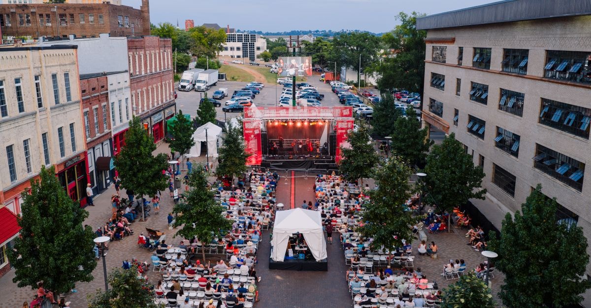 A lively outdoor concert attended by a large crowd in Chattanooga, Tennessee.