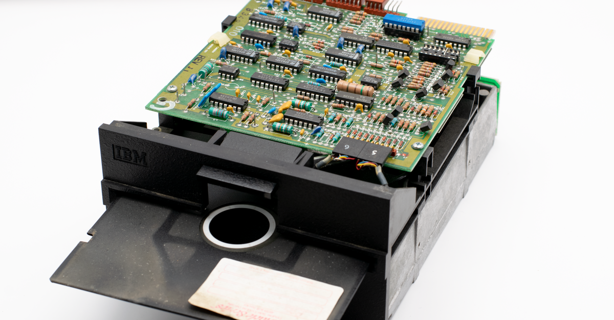 Analog Devices to Acquire Alif Semiconductor for Up to $1.55 Billion Close-up view of a vintage IBM circuit board and disk drive showcasing retro computer technology.