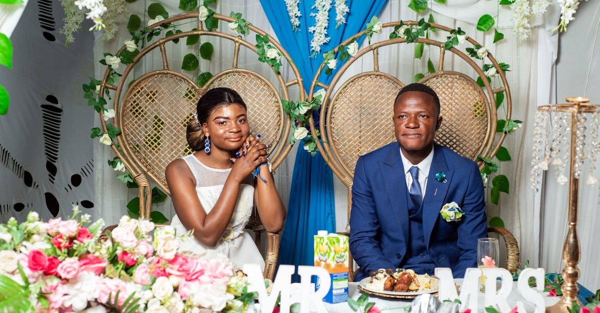Bride and groom at an elegant wedding reception in Likasi, DR Congo.