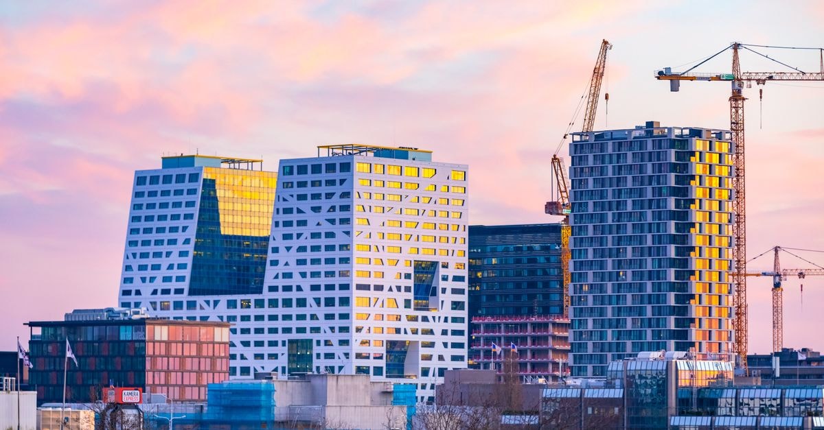 Utrecht cityscape featuring contemporary architecture at sunset.
