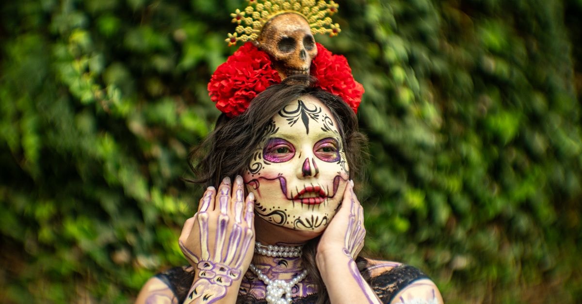 Close-up of a woman with Catrina makeup for Day of the Dead in Mexico City.