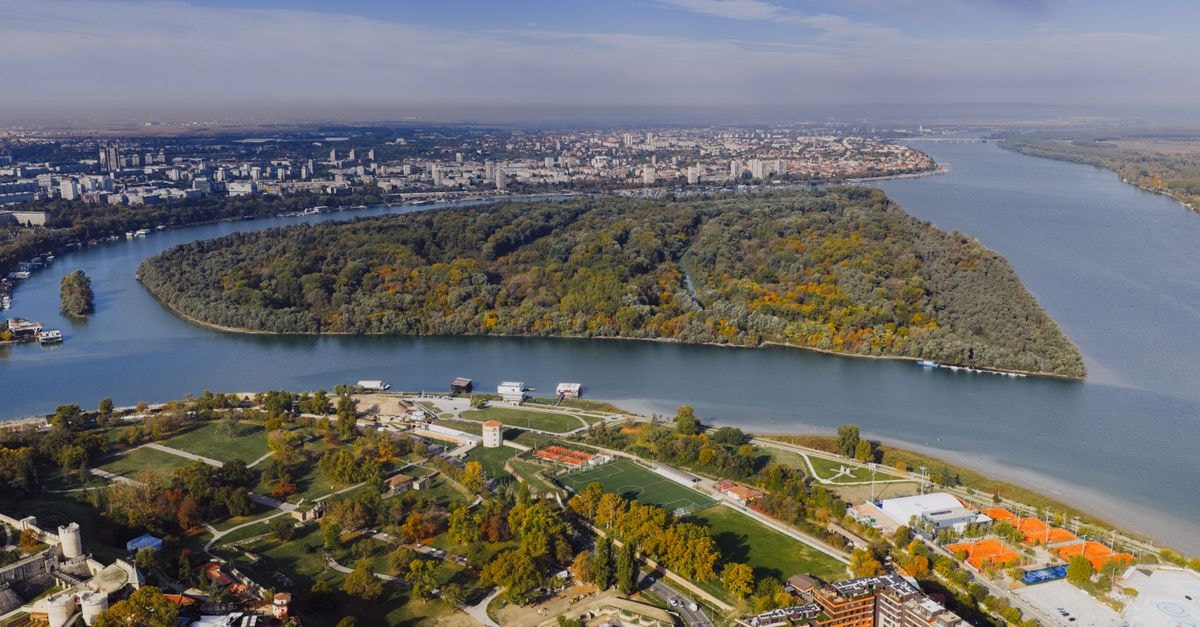 Vukovar Travel Guide: Danube Heritage and Quiet Discovery Stunning aerial view of Kalemegdan Park and the Danube River in Belgrade, Serbia, showcasing vibrant autumn colors.