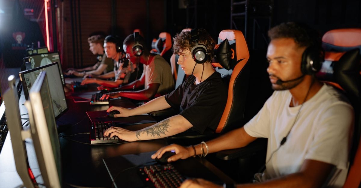 Bills safety Sam Franklin’s spitting suspension reduced to fine after appeal A group of focused young gamers playing in an intense esports tournament indoors.