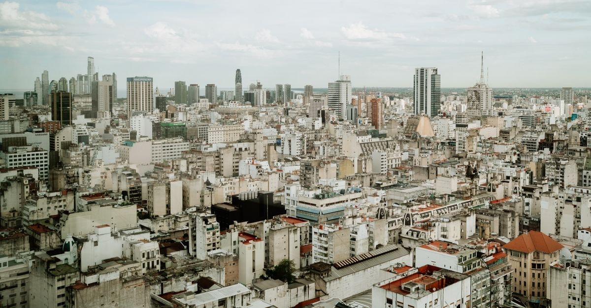 Hotel Viejo Telmo, Buenos Aires: BBQs, Milongas & Spanish Classes Aerial view of Buenos Aires skyline showcasing urban architecture and cityscape.