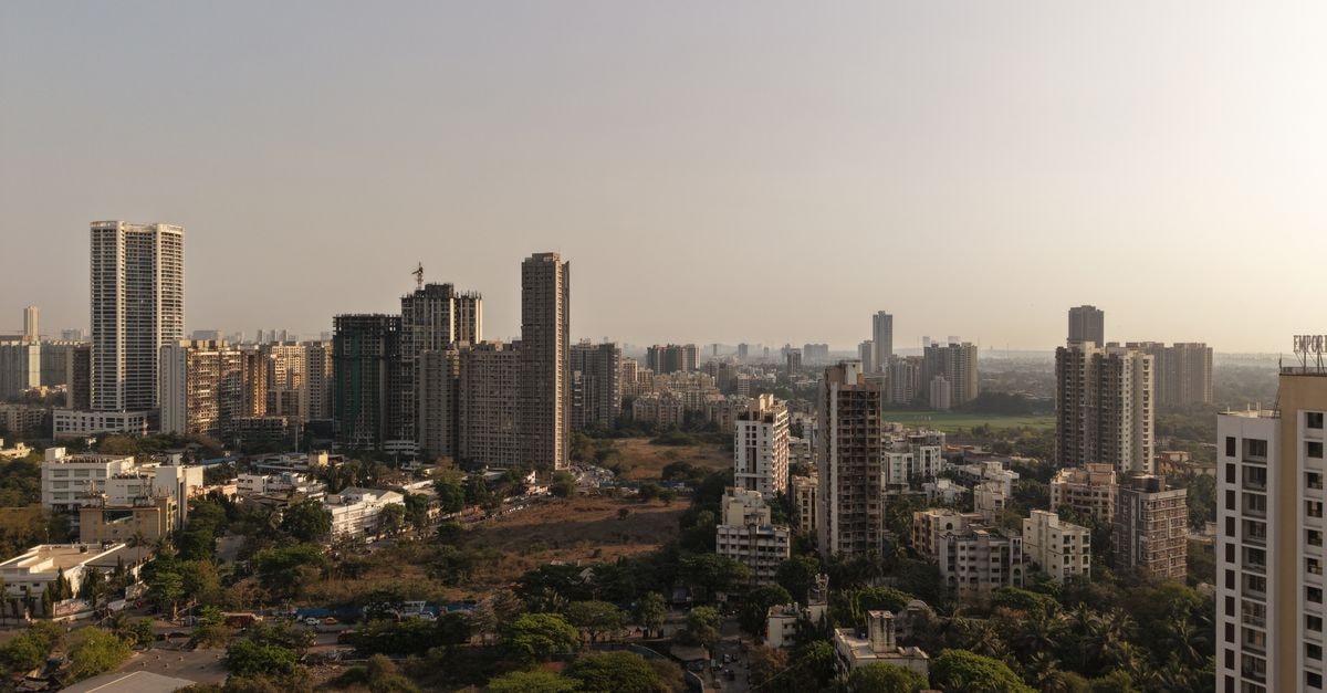 Aerial view capturing the modern skyline of Mumbai's urban architecture during the day.