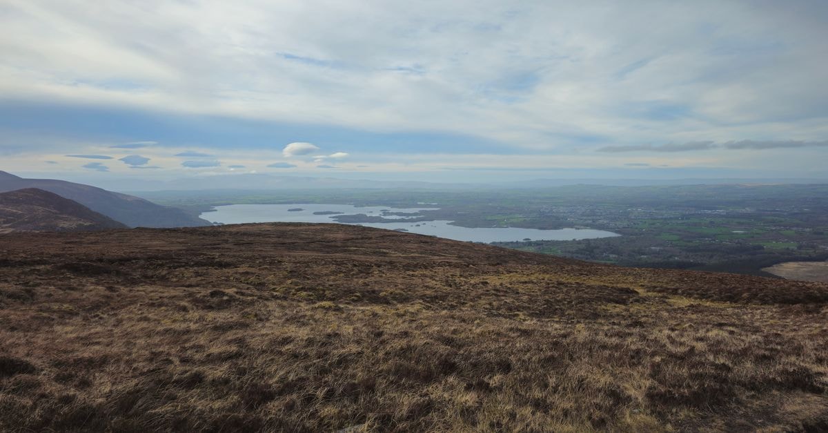 Murphy's in Killarney: A Cosy Kerry Landmark on the National Park's Doorstep Breathtaking view over Killarney Lakes with dramatic skies and rolling hills in County Kerry, Ireland.