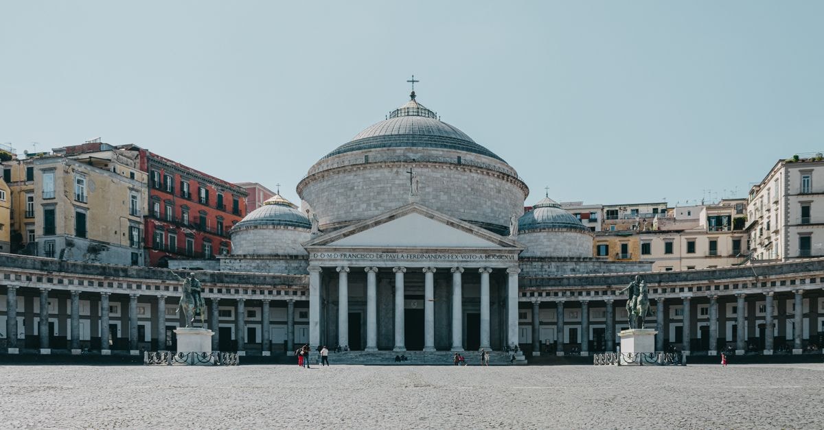 Hotel Piazza in Peshkopi: Boulevard Stay Near Mountain Trails View of the iconic Piazza del Plebiscito and San Francesco di Paola in Naples, Italy.