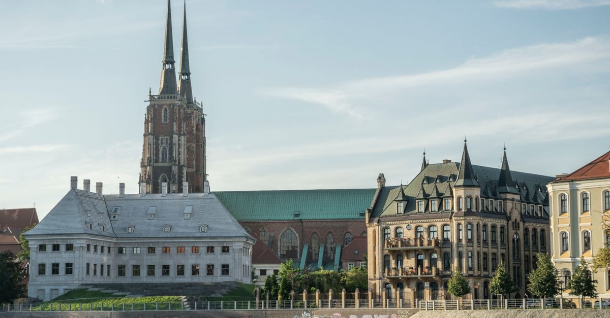 Szczecin Travel Guide: Planning Tips, Costs and Things to Do St. John the Baptist Cathedral and waterfront buildings in Wrocław, Poland.