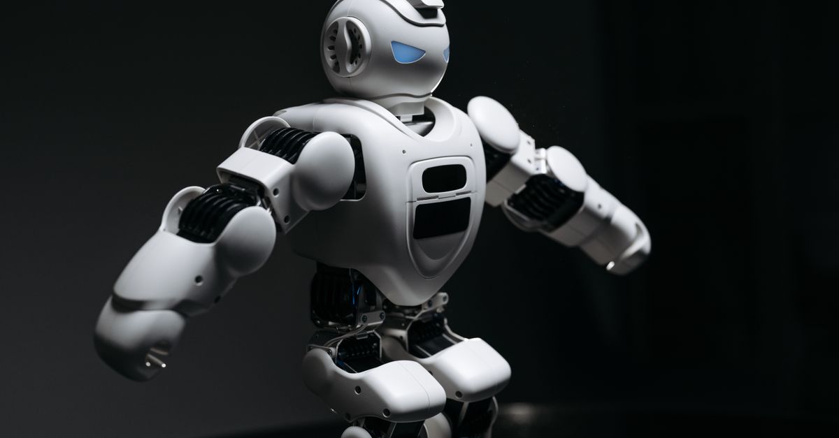 Samsung launches humanoid robotics division as AMD, UK's Humanoid, and Tesla advance competing programs Close-up of a futuristic humanoid robot under dramatic lighting in dark ambiance.